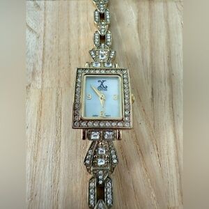 Franz Xavier ladies gold tone crystal accented watch NEW BATTERY